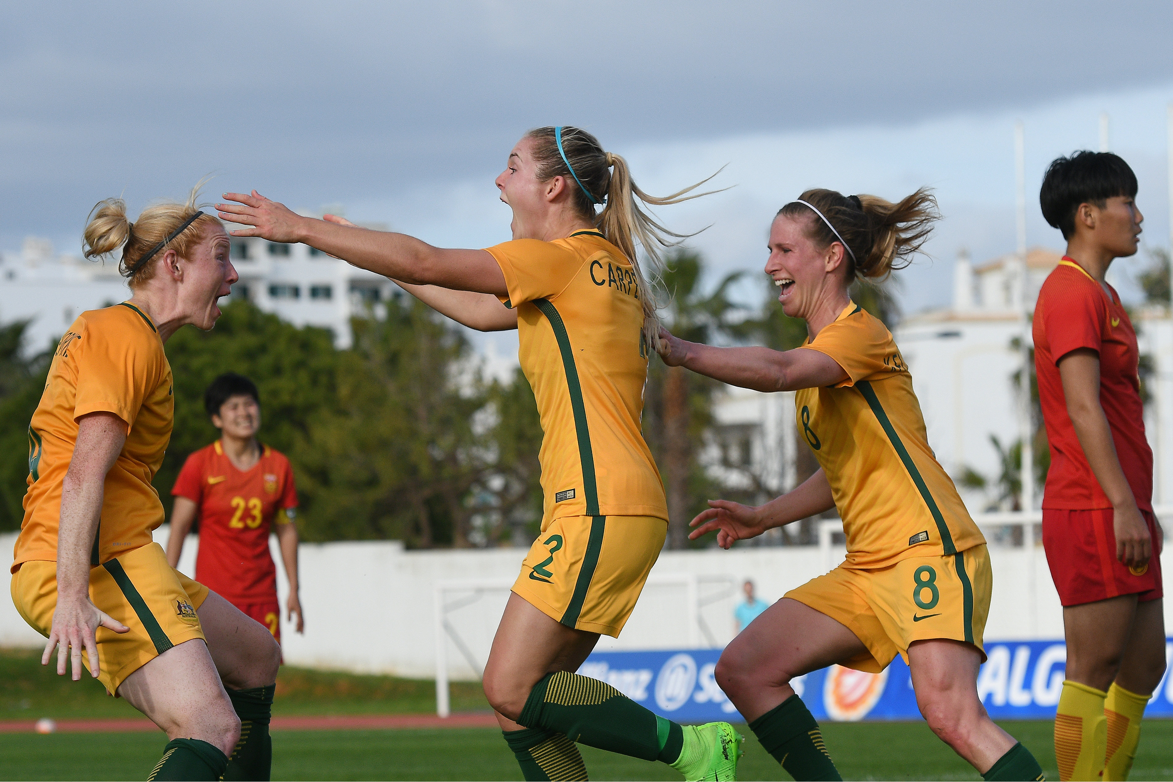 Ellie Carpenter celebrates scoring against China.