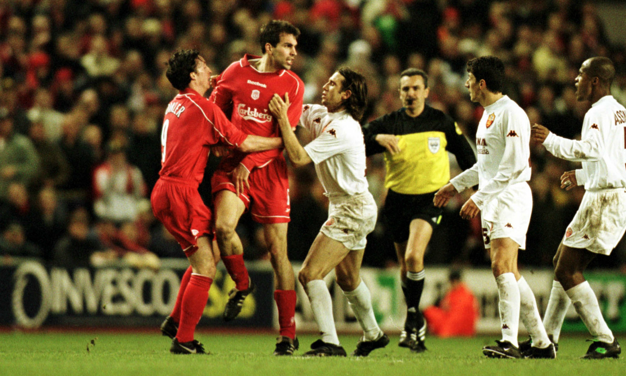 Robbie Fowler stops Markus Babbel boiling over in a UEFA Cup clash against AS Roma.