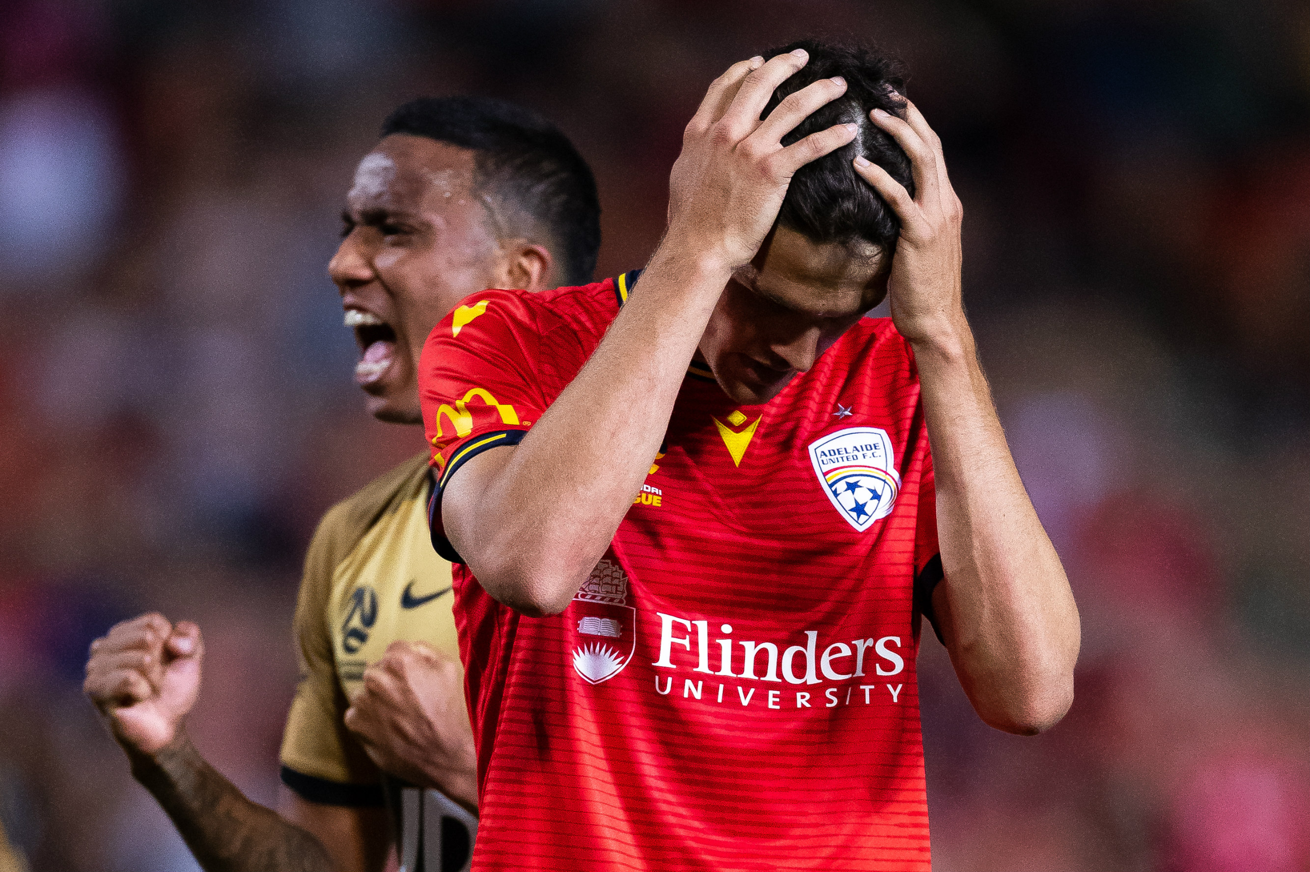 George Blackwood has his head in his hands after missing a late penalty