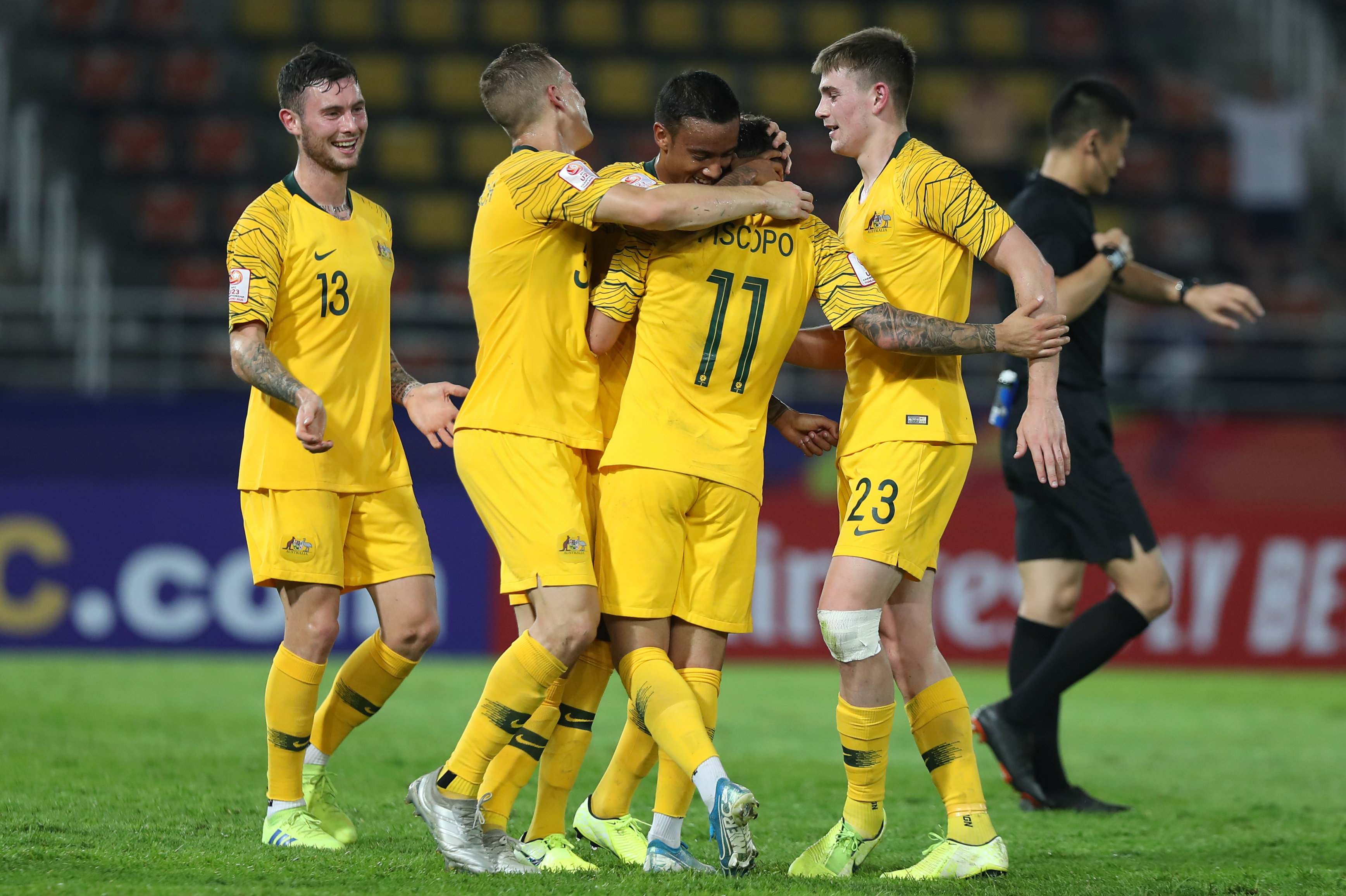 Australian players celebrate Piscopo's stunning goal