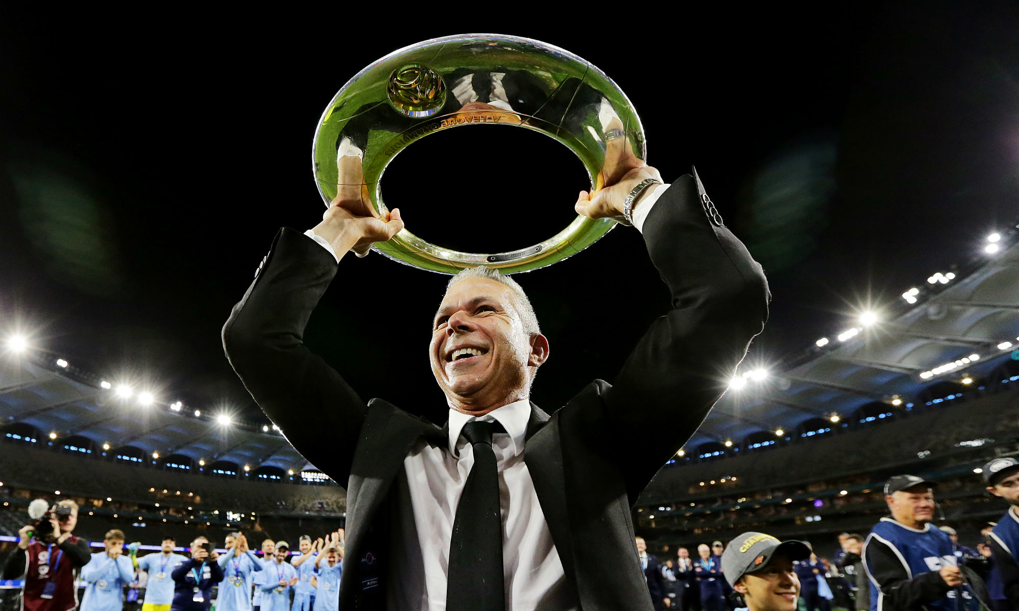 Corica after capturing his first silverware as a head coach, following the Grand Final win against Perth Glory.