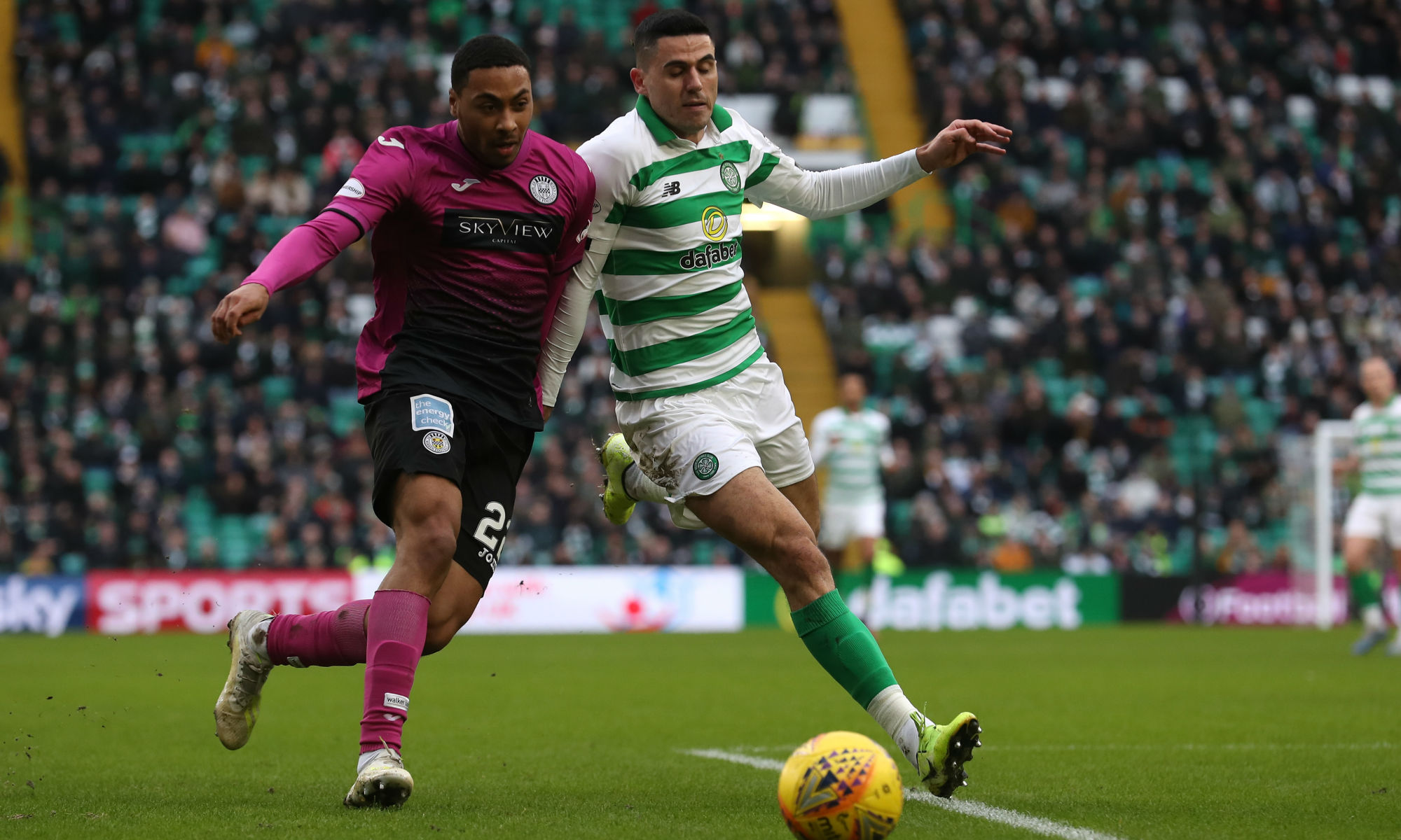 Celtic and Socceroos playmaker Tom Rogic battles for the ball against St Mirren