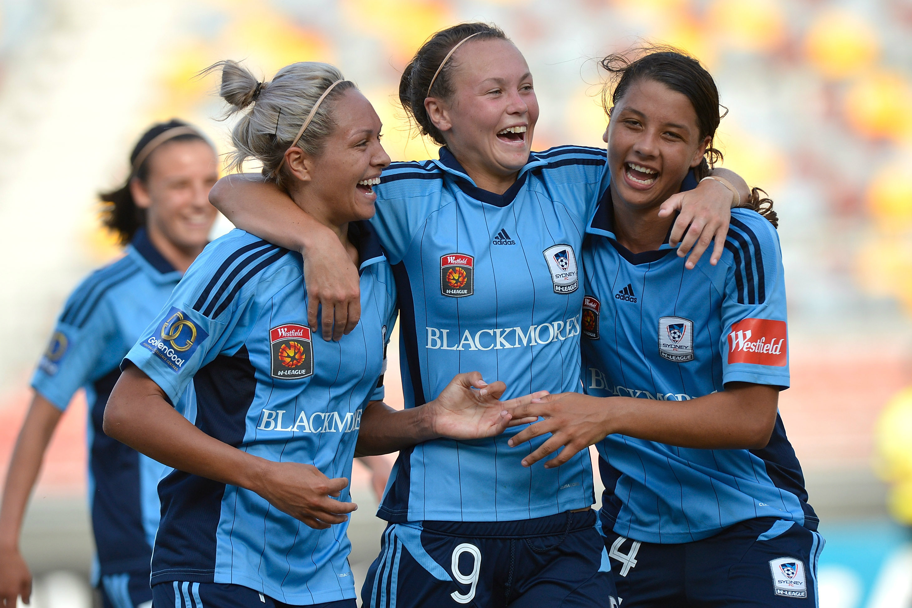 Kyah Simon, Caitlin Foord and Sam Kerr celebrate a goal for Sydney FC