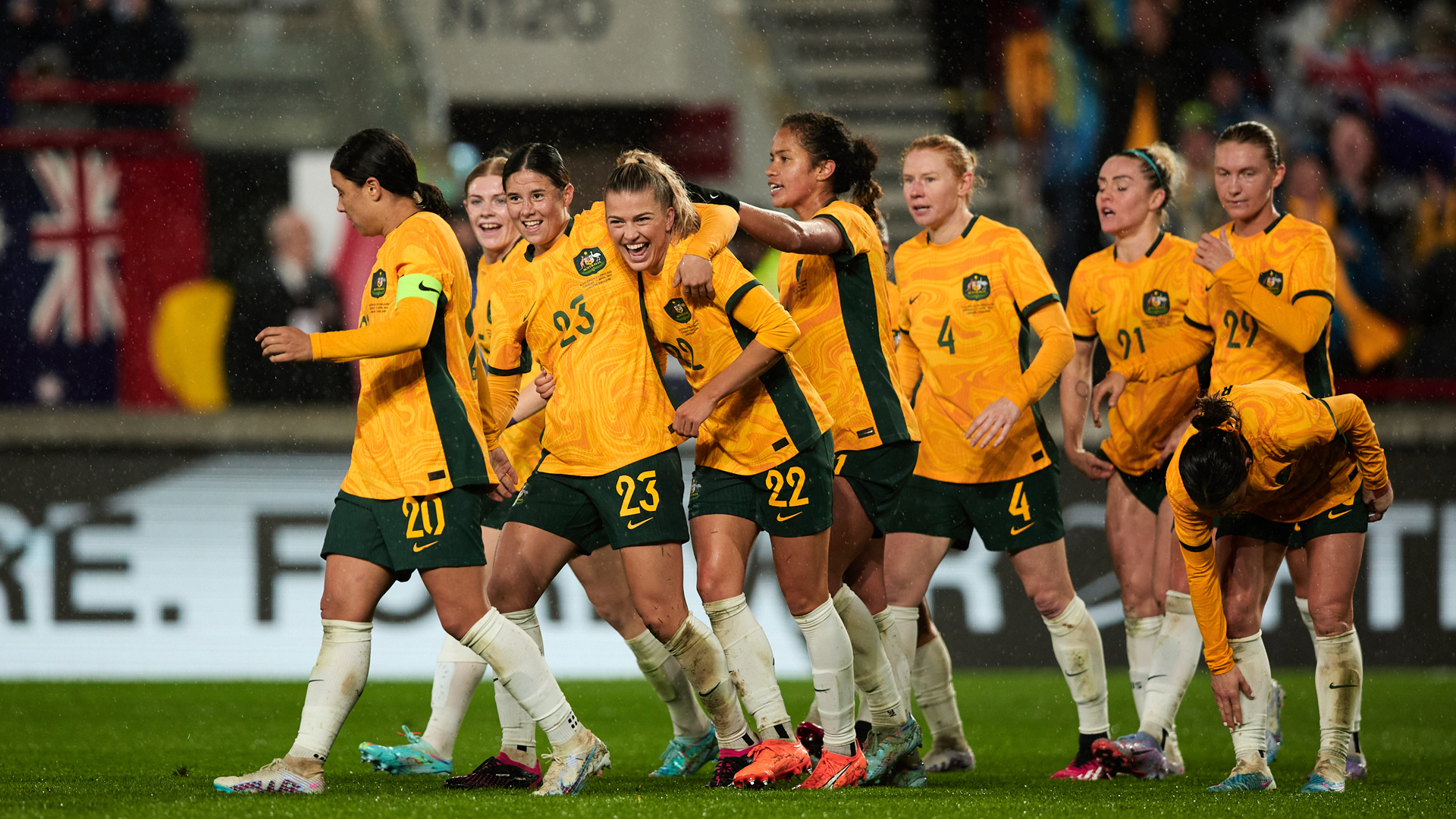 Kyra Cooney-Cross celebrating with teammate Charli Grant after Australia's goal against England in London. (Photo: Rachel Bach/By The White Line)