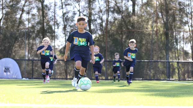 Young footballers enjoying the ALDI Miniroos activities.