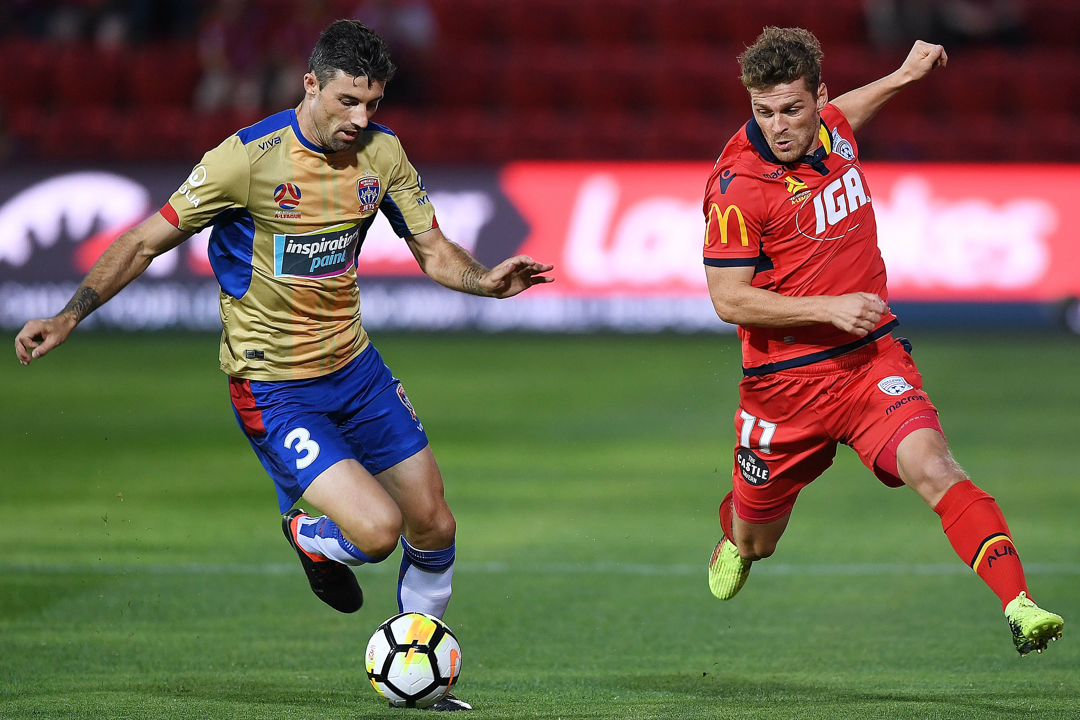 Jason Hoffman is put under pressure by Adelaide's Johan Absalonsen.