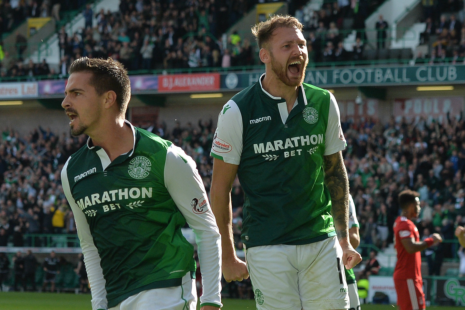 Martin Boyle celebrates a goal with Hibs teammate Jamie Maclaren.