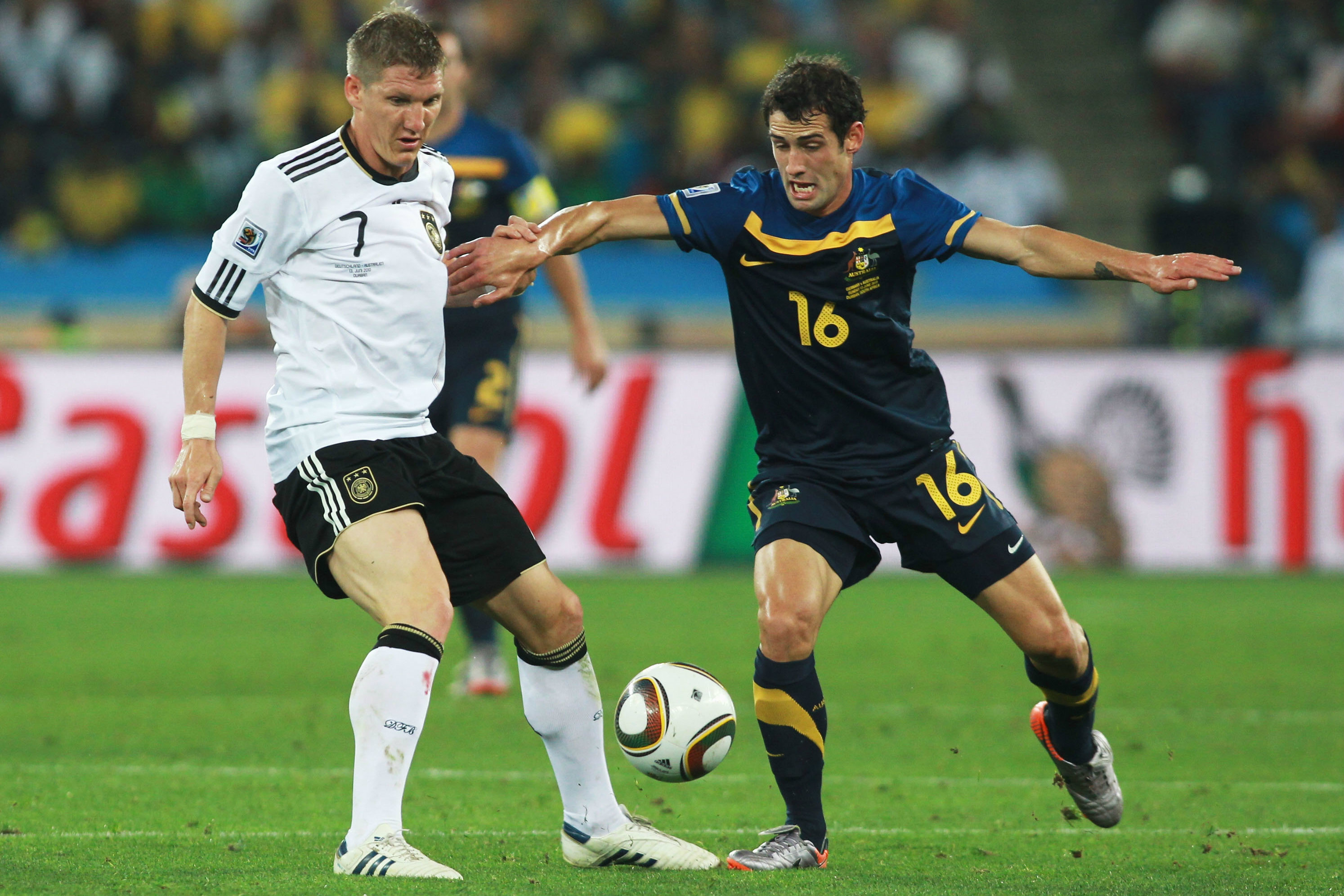 Carl Valeri battles with Bastian Schweinsteiger at the 2010 World Cup