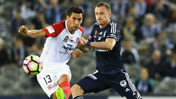 Wanderers' Bruno Pinatares clears the ball from Victory's Besart Berisha.