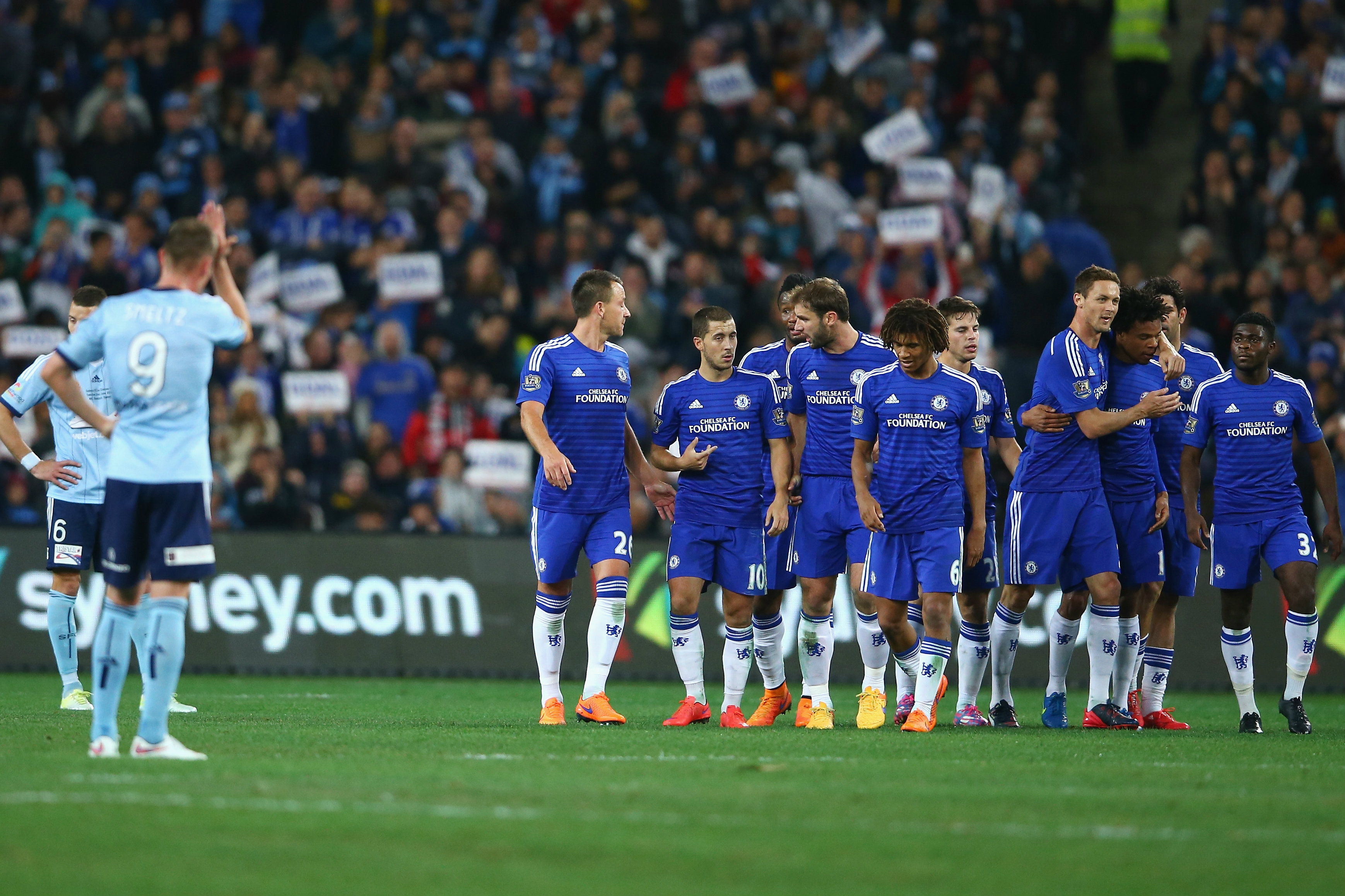 Chelsea players celebrate Loic Remy's goal against Sydney FC in 2015.