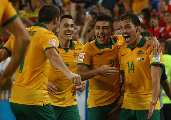 Caltex Socceroos celebrate James Troisi's winning goal in the 2015 Asian Cup final.