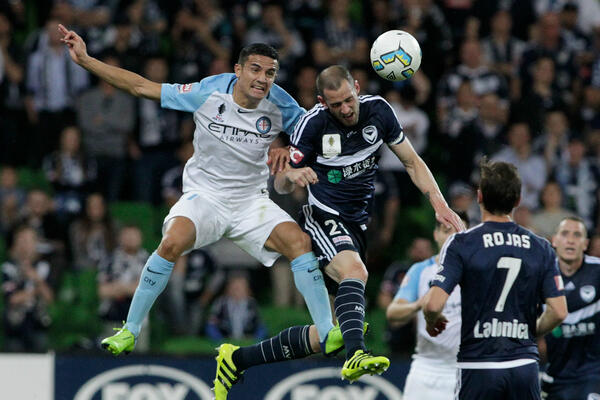 Tim Cahill and Carl Valeri battle for a header during the 2016 semi-final.