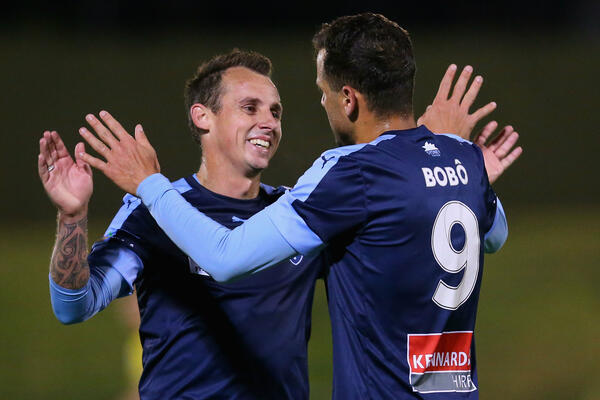 Luke Wilkshire and Bobo celebrate a Sydney FC goal in the Westfield FFA Cup.