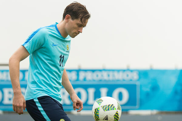 Craig Goodwin on the raining pitch in Honduras.