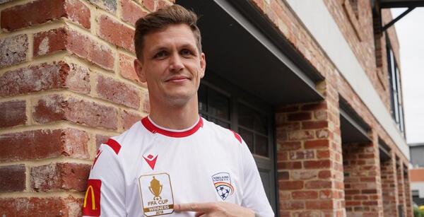 Michael Jakobsen models the new Adelaide United away strip