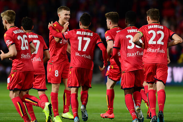 Adelaide United celebrate a goal