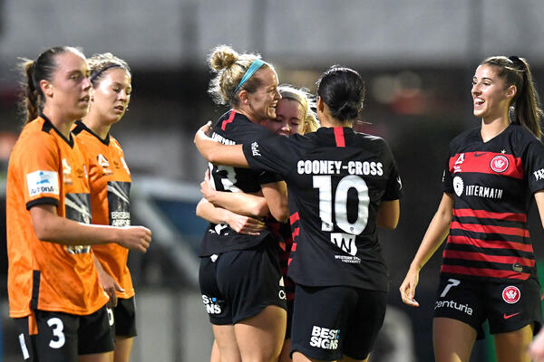 Kristen Hamilton celebrates a goal for Wanderers