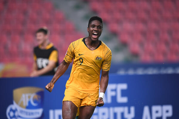 Al Hassan Toure celebrates winning goal v Syria