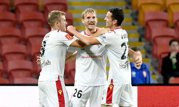Ben Halloran fired Adelaide United into a lead against his former club Brisbane Roar