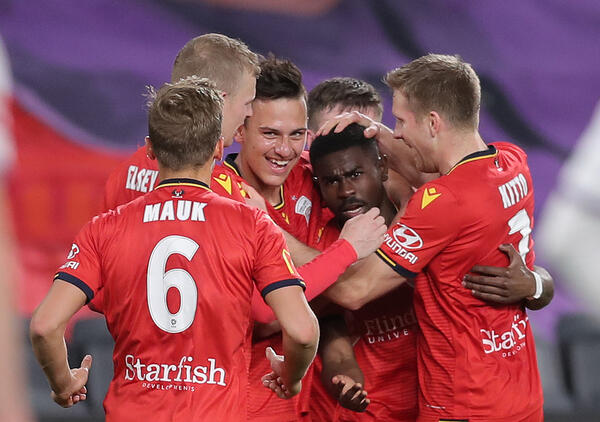 Adelaide United celebrate a goal