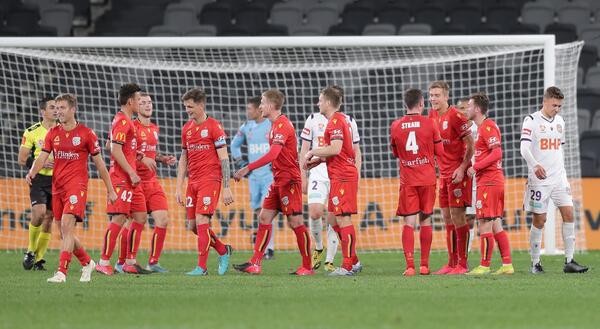 Adelaide United celebrate a goal