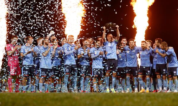 Alex Wilkinson Sydney FC Premiers Plate lift