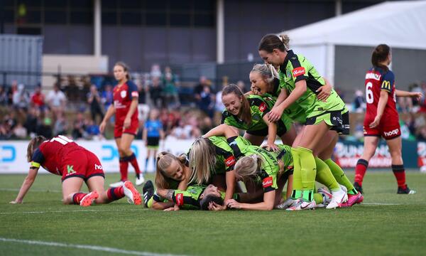 Michelle Heyman gets mobbed after netting on her Westfield W-League return against Adelaide United.