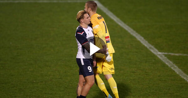 Andrew Redmayne bumps Jason Cummings after saving his penalty in the shootout