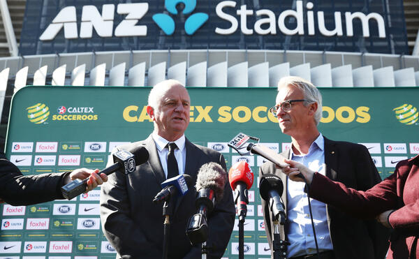 Graham Arnold addresses the assembled media at ANZ Stadium
