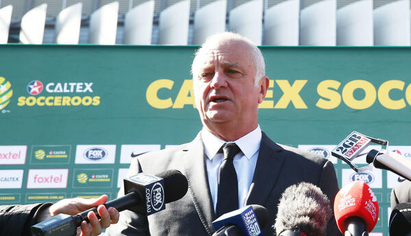 Graham Arnold addresses the assembled media at ANZ Stadium