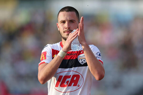 Adelaide United pair sign senior contracts