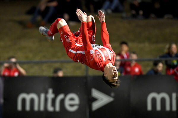 Olympic FC's Chris Lucas goes acrobatic to celebrate one of his three goals against Bayswater City