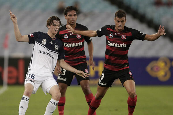 Melbourne Victory's Josh Hope and Wanderers' Oriol Riera.