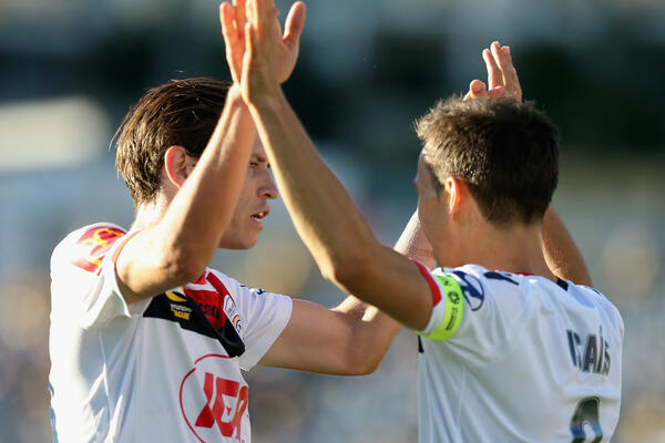 Adelaide United celebrate a goal.