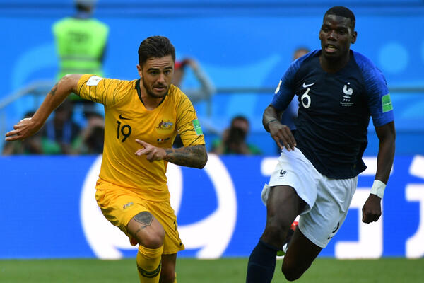 Josh Risdon races clear from France's Paul Pogba.