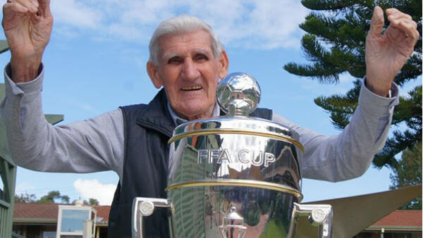 Former Socceroo Joe Marston with the Westfield FFA Cup trophy.
