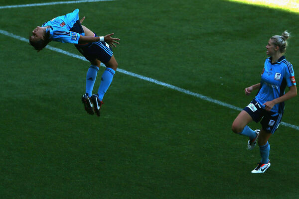 Sam Kerr shows off her now-trademark somersault celebration.